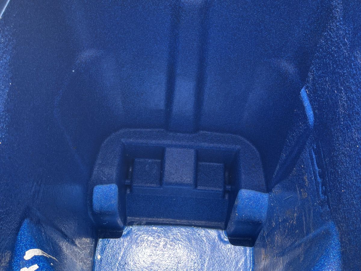 The same bin latch and interior after a Been There Cleaned That deep clean — grime and residue washed away